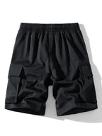 Pantalón corto de tela negro, cintura elástica y bolsillos cargo laterales.