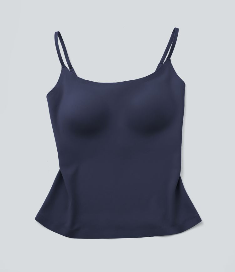 Top sin mangas Naomi Essential azul marino tipo peplum, tirantes finos