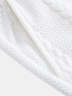 Tela del pantalón corto Capri blanco con textura de relieve en patrón