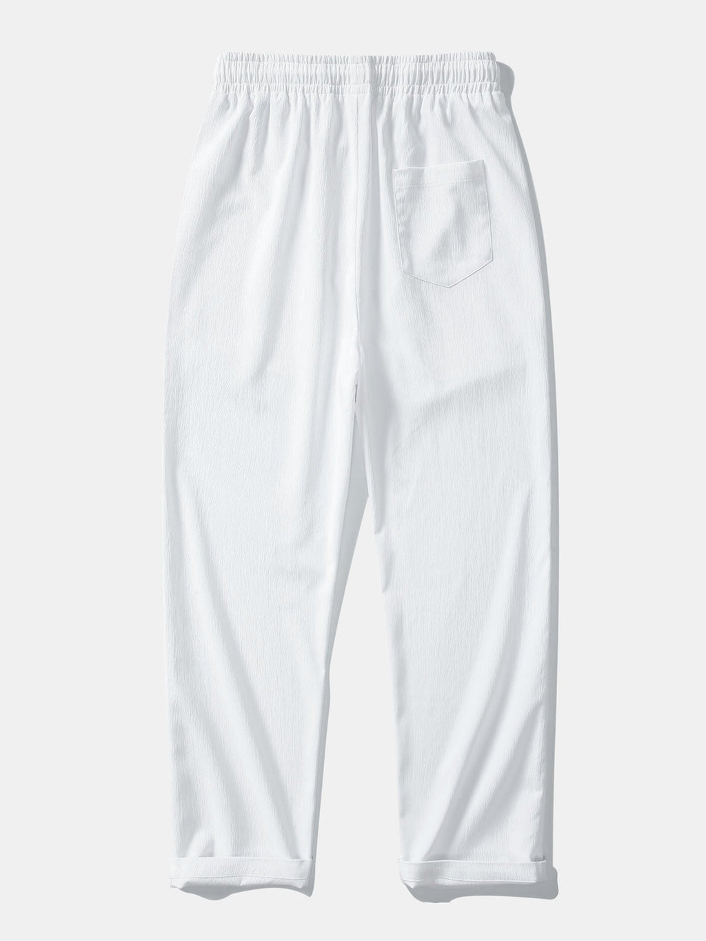 Pantalón recto texturizado blanco con bolsillo lateral y cintura elástica con cordón.