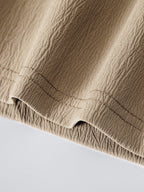 Pantalón corto beige con dobladillo elástico acanalado