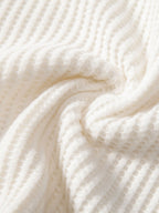 Tejido de rizo de polo crema con relieve fino y patrón texturizado