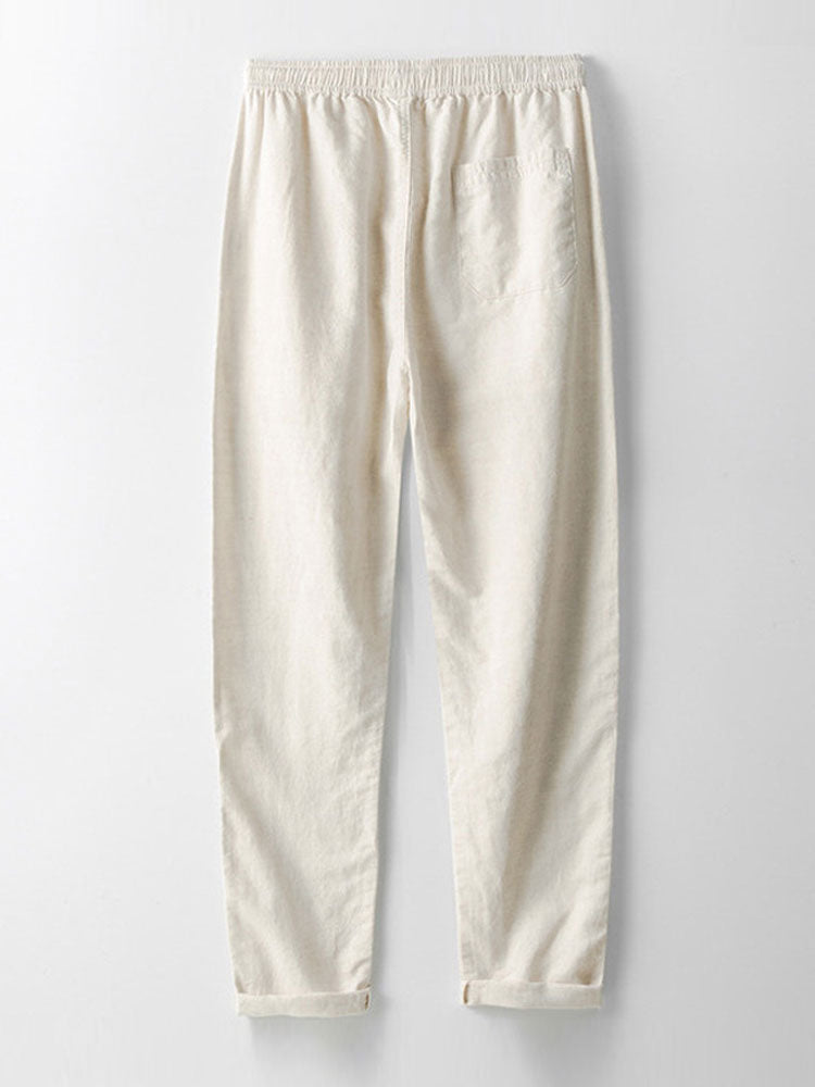 Pantalones de lino crema de corte recto, cintura elástica y dobladillo visible
