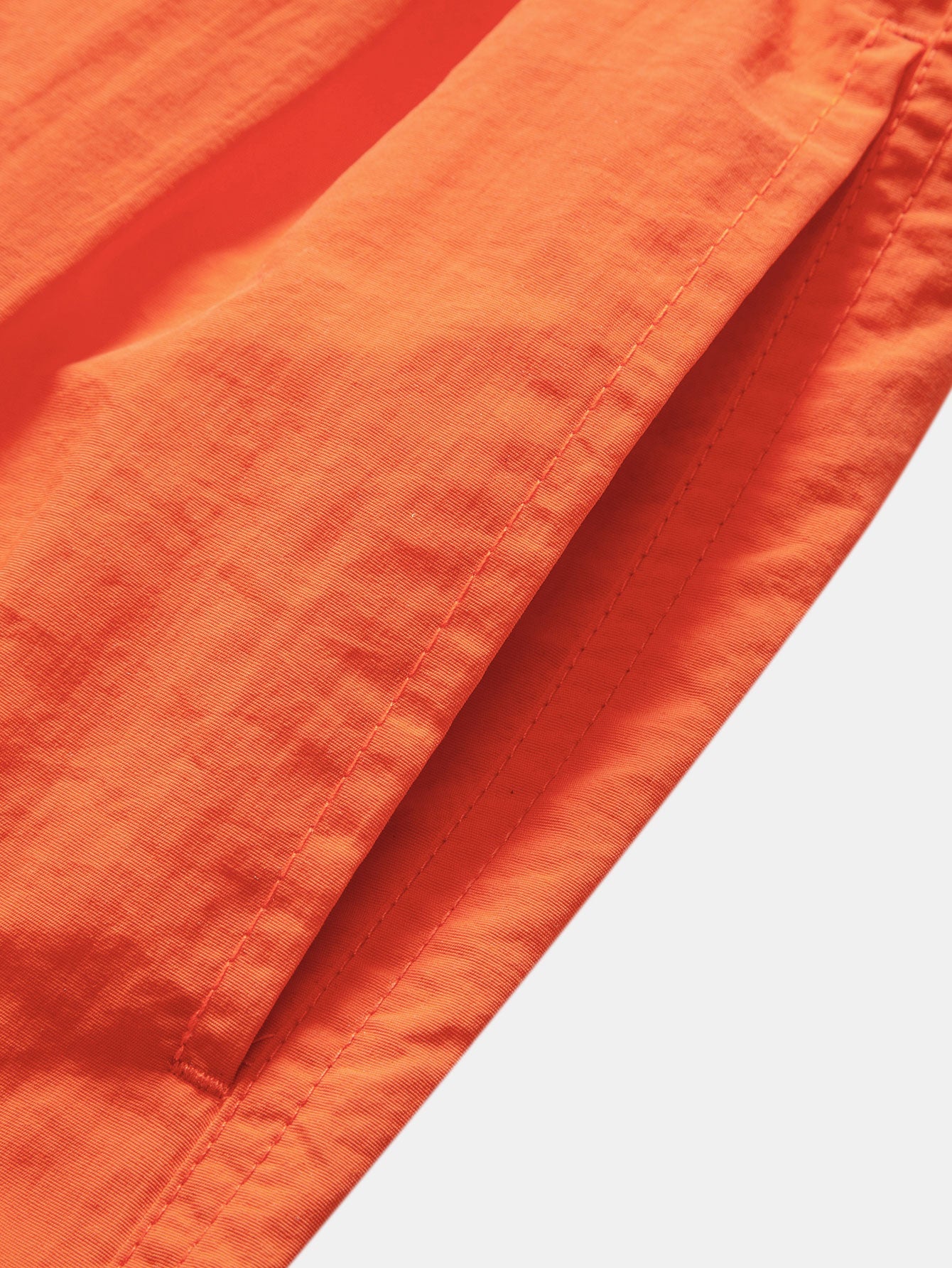 Camisa de rayas naranjas y blancas: costuras en la tela