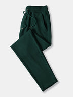 Pantalón recto acanalado verde oscuro con cinturilla elástica y cordón, pierna ajustada