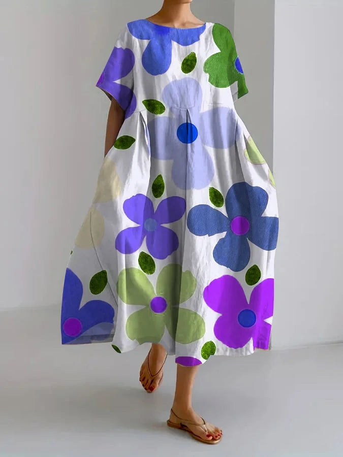 Vestido fluido Eli midi con estampado floral multicolor, base clara y mangas cortas