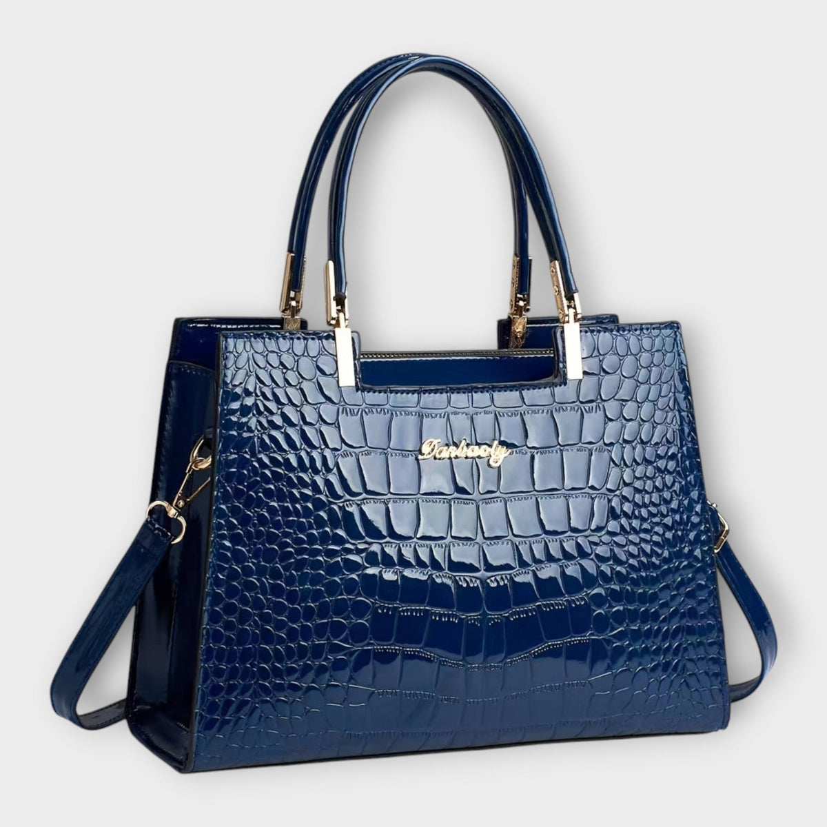 Bolso de piel efecto cocodrilo azul con asas superiores y bandolera