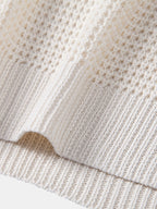 Polo sin mangas crema con bajo acanalado y costura