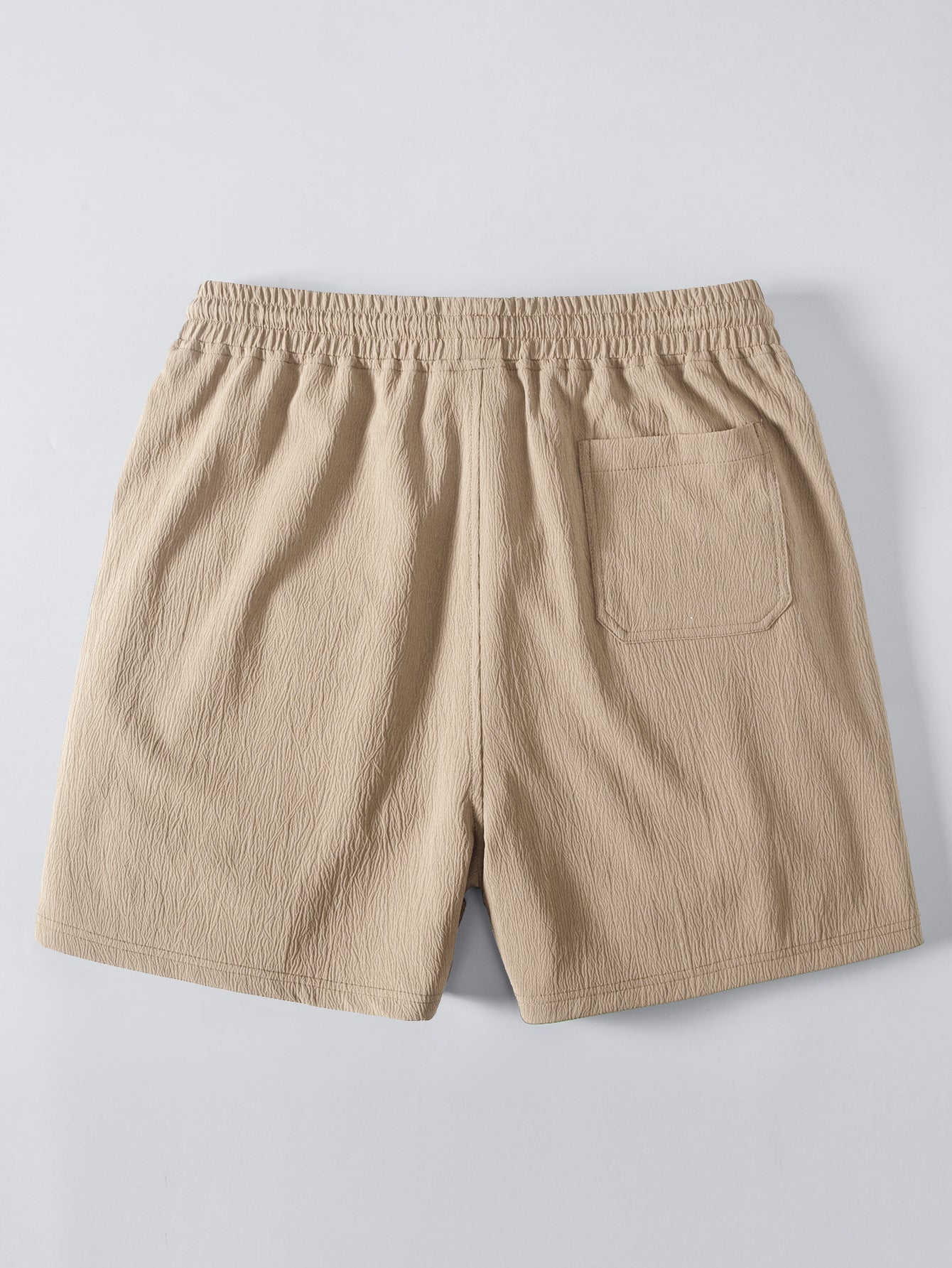 Pantalón corto beige con cintura elástica y bolsillo trasero integrado