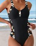 Bañador negro con tirantes florales y escote pico, abertura frontal con nudo