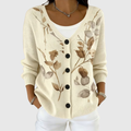Chaqueta de punto color crema, estampado floral y botones negros, cuello en V