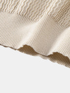 Polo Portofino de punto beige, vista del bajo acanalado y tejido con textura