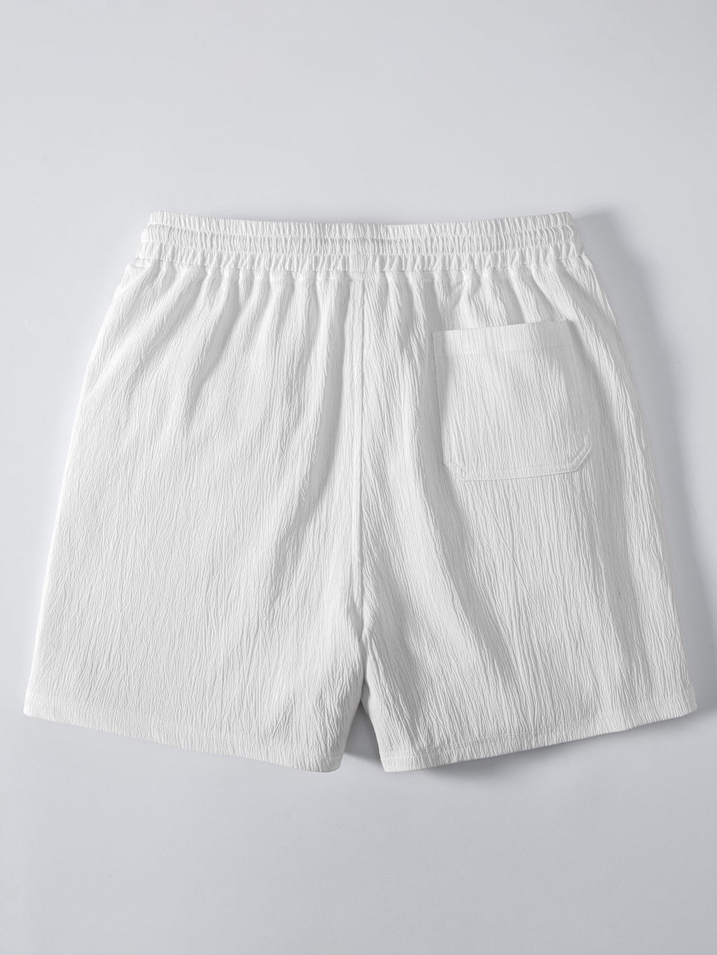 Pantalón corto blanco con cintura elástica y bolsillo trasero en el lateral