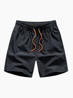 Bañador corto negro con cintura elástica y cordón naranja
