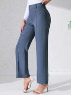 Pantalón de talle alto azul marino con bolsillos y costuras frontales, corte recto y bota ancha