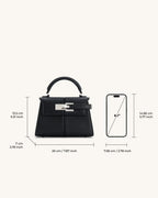 Bolso Ciela Spiral negro con asa superior y cierre frontal tipo solapa con hebilla