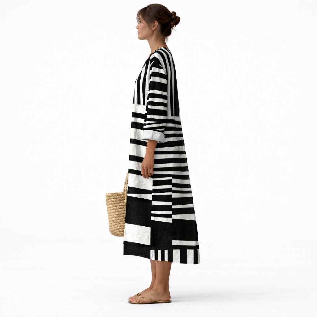 Vestido midi de rayas gráficas blanco y negro, escote V y manga 3/4, lateral