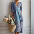 Vestido ligero patchwork azul y blanco, escote V, mangas 3/4 y dobladillo a media pierna