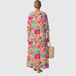 Vestido midi floral multicolor, espalda lisa, mangas 3/4 y caída suelta