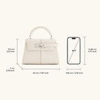 Bolso Ciela Spiral blanco con asa redondeada y solapa frontal con hebilla