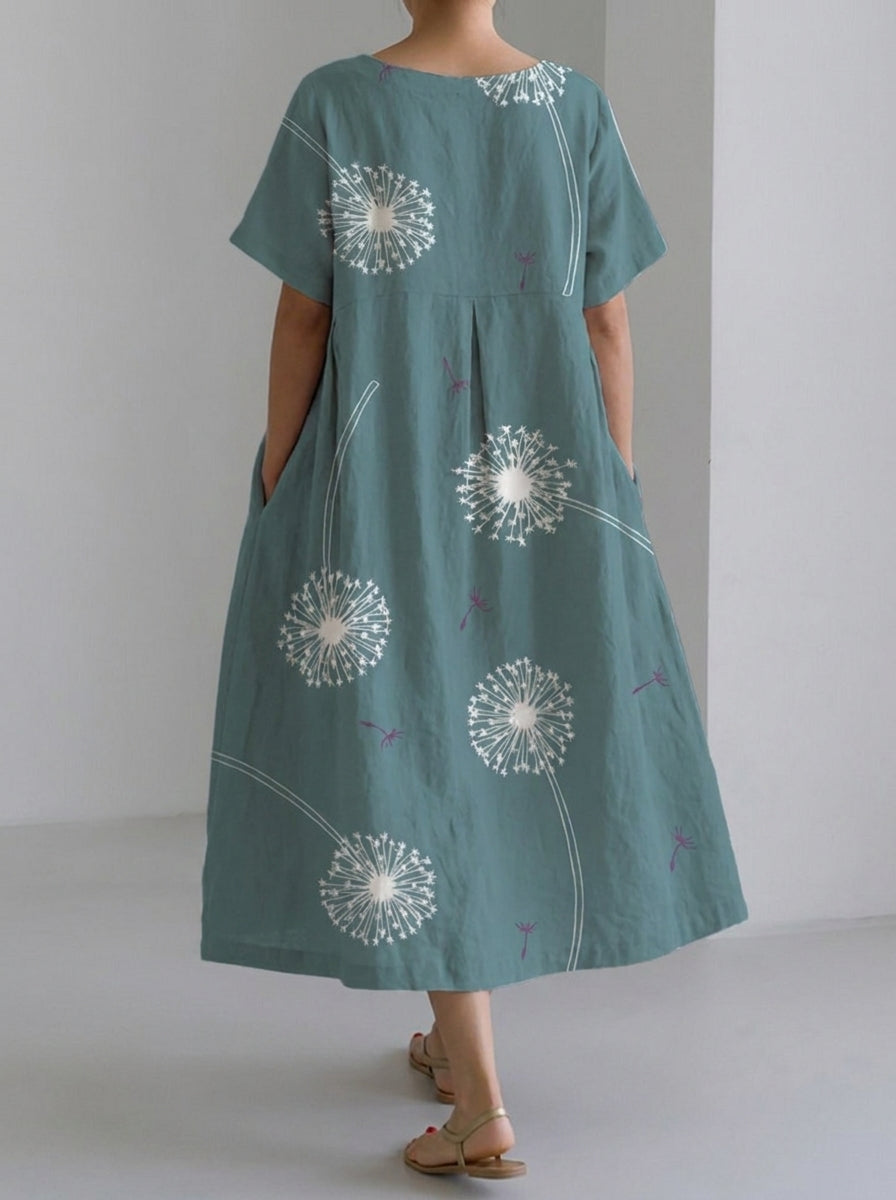 Vestido fluido verde con mangas cortas y estampado de flores blancas, falda amplia