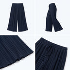 Pantalón plisado fluido azul marino oscuro, corte ancho y cintura elástica
