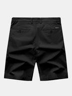 Pantalón corto negro de algodón, costuras marcadas y bolsillos con botón