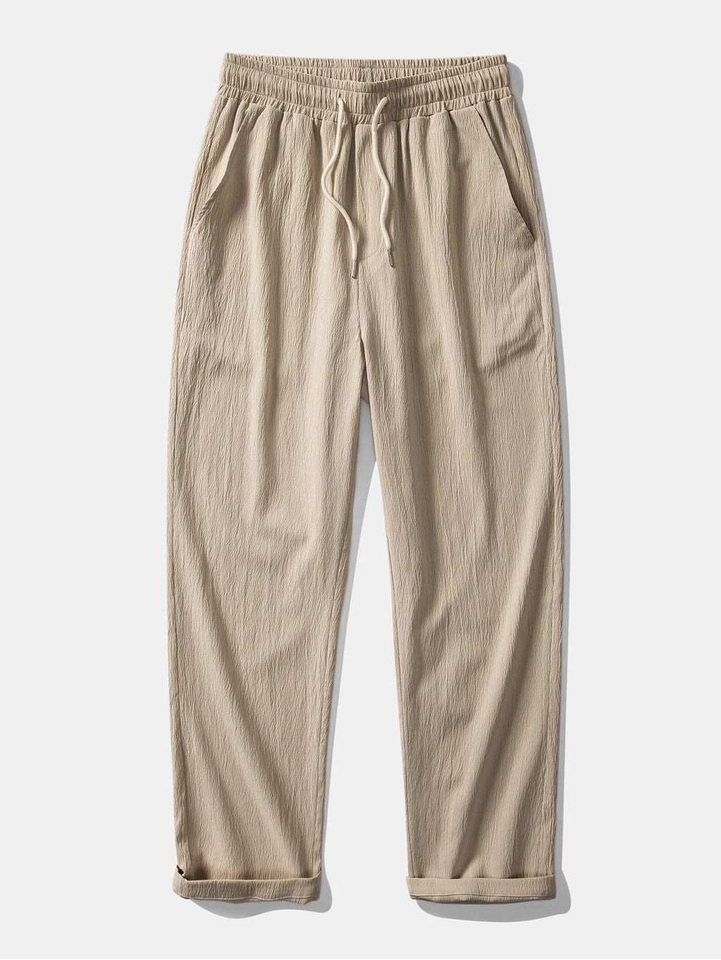 Pantalón recto beige con cintura elástica y cordón, textura arrugada y puños doblados