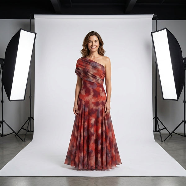 Vestido largo de un hombro con falda amplia plisada, estampado rojo y granate