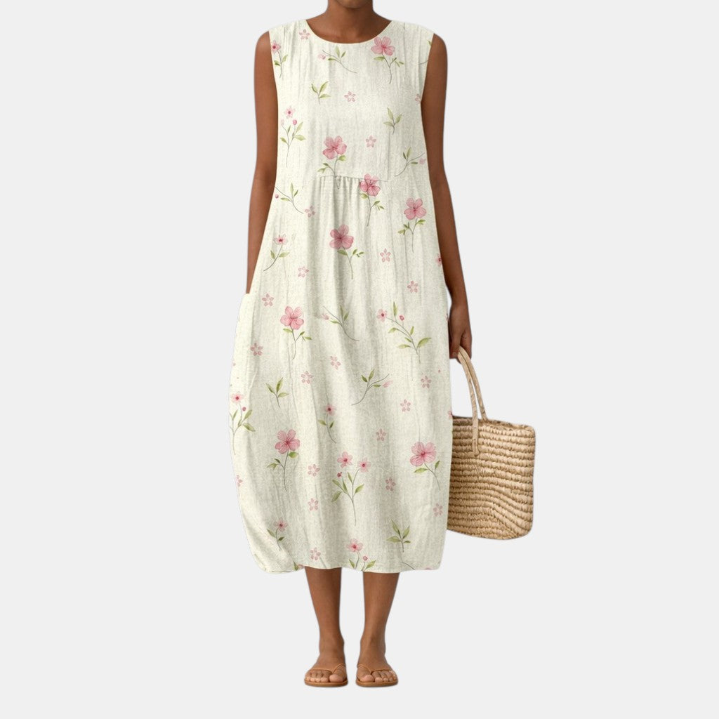Vestido midi sin mangas con cuello redondo y estampado floral rosa, falda amplia con pliegues