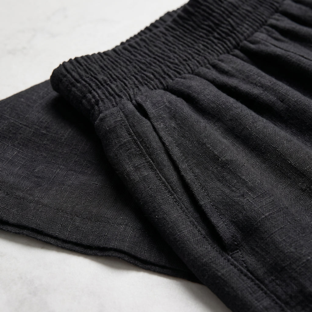 Pantalón de corte fluido negro: tela con frunces en la cintura