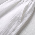 Tela de lino y algodón blanca con textura ligera y costuras visibles