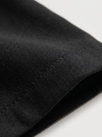 Pantalón sastre Siena negro: vista de tela lisa y costura interior del bajo
