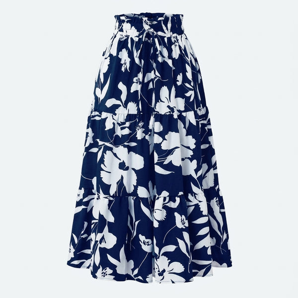 Falda plisada azul marino con estampado floral blanco, diseño con vuelo