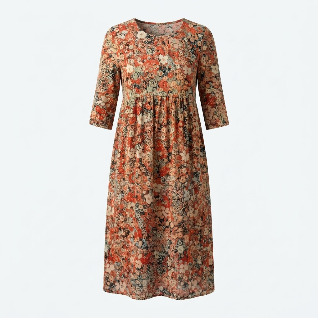 Vestido Amalfi midi floral en plano, manga tres cuartos y cuello redondo.