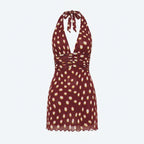 Vestido corto burdeos con lunares amarillos, cuello con lazo y tirantes cruzados