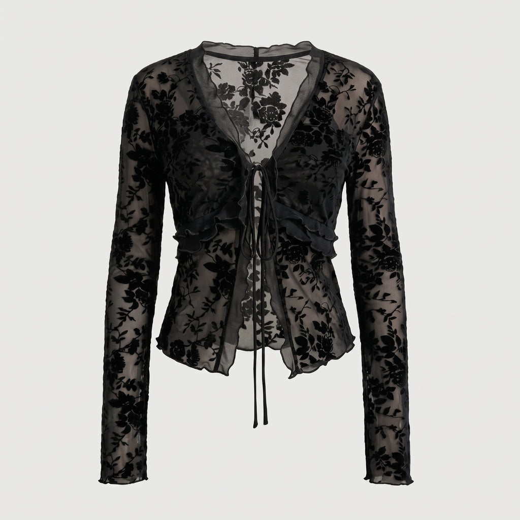 Blusa negra tipo peplum de encaje floral con cordones en el centro