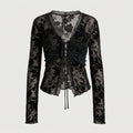 Blusa negra tipo peplum de encaje floral con cordones en el centro