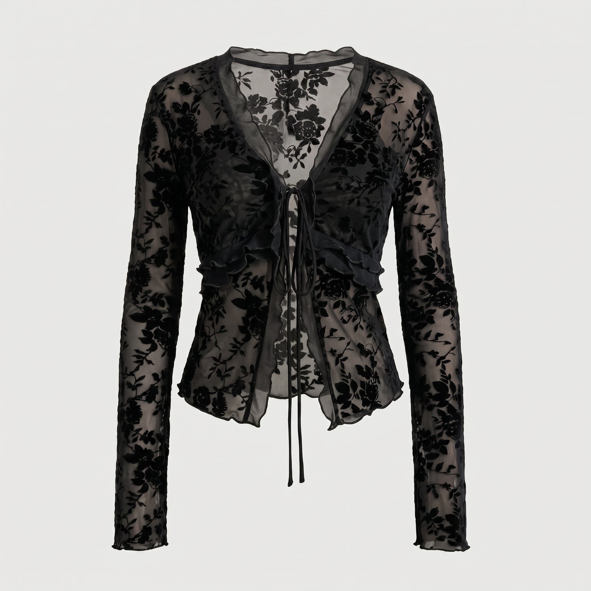 Blusa negra tipo peplum de encaje floral con cordones en el centro