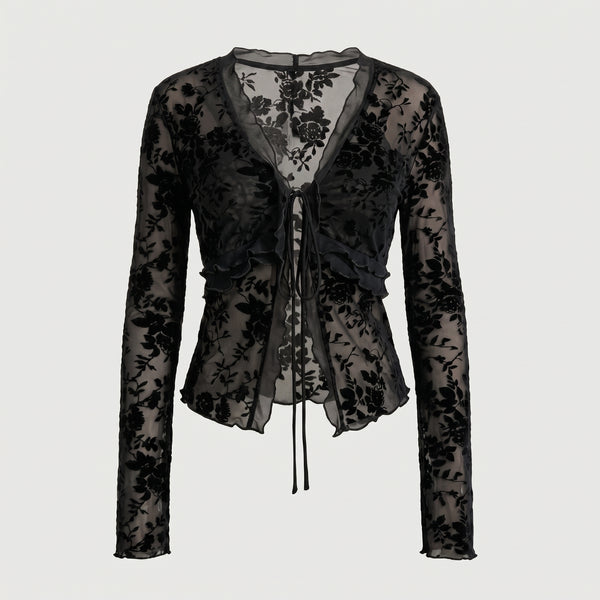 Blusa negra tipo peplum de encaje floral con cordones en el centro