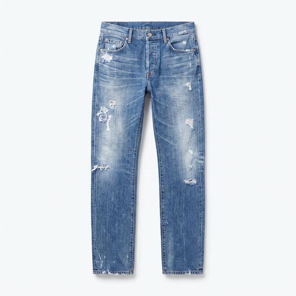 Vaquero de corte ancho azul claro, cintura con trabillas y rotos en las piernas