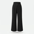 Pantalón de lino negro, cintura elástica y botones frontales, pierna ancha