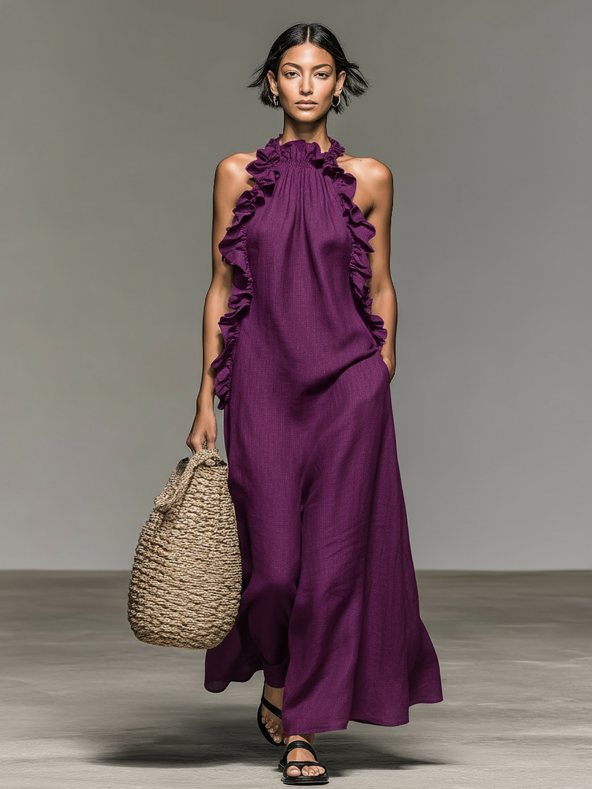 Vestido largo de lino violeta con volantes en el escote y espalda descubierta, sin mangas.