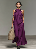 Vestido largo de lino violeta con volantes en el escote y espalda descubierta, sin mangas.