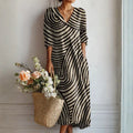 Vestido largo bohemio de rayas blanco y negro, escote en V y manga 3/4