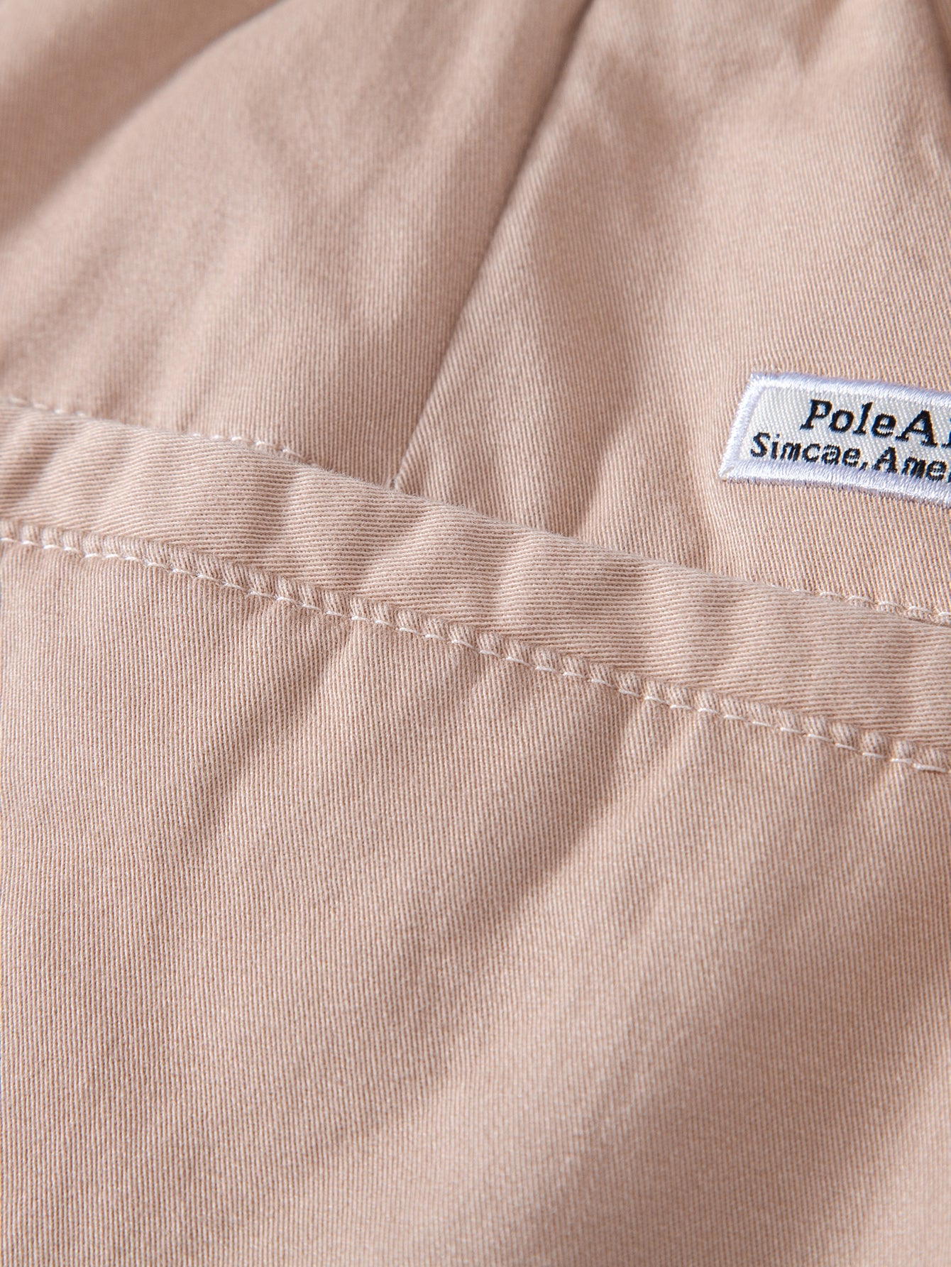 Pantalón corto Verona beige claro: etiqueta interior cosida