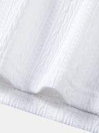 Polo blanco jacquard con dobladillo acanalado