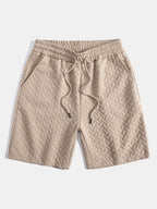 Pantalones cortos de jacquard geométrico beige con cintura elástica y cordón