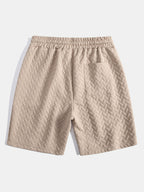 Pantalones cortos de jacquard geométrico beige con tiro recto y cordón
