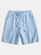 Pantalones cortos de jacquard geométrico azul claro con cintura elástica y cordón